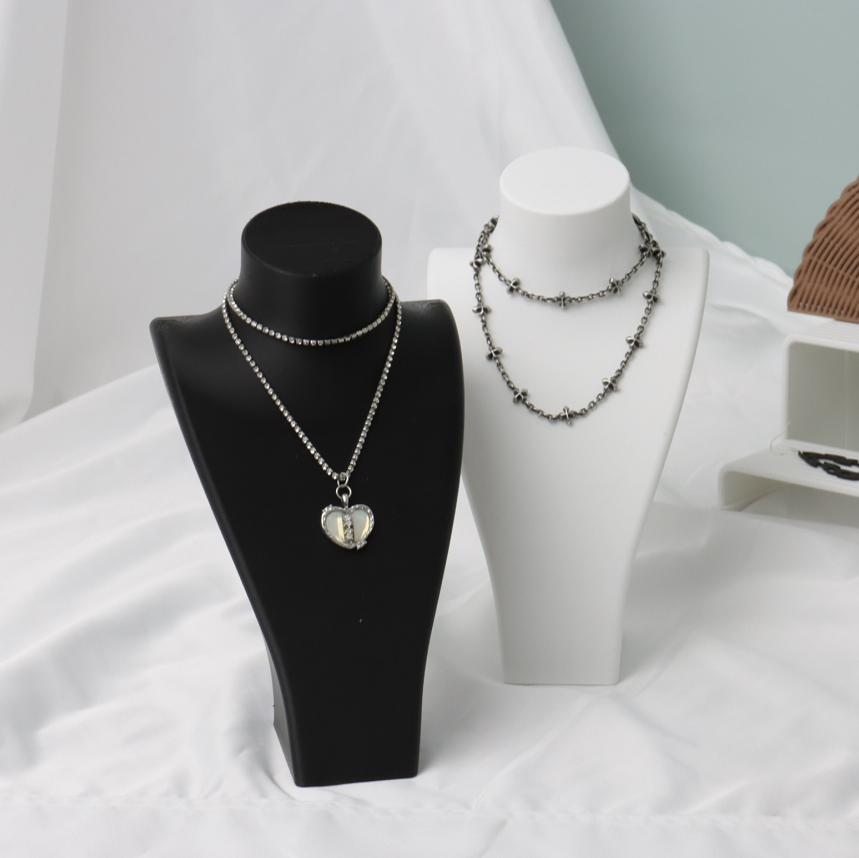 3D - printed necklaces on display stands, showcasing customizable jewelry options, a testament to the versatility of 3D printing in creating unique fashion accessories.